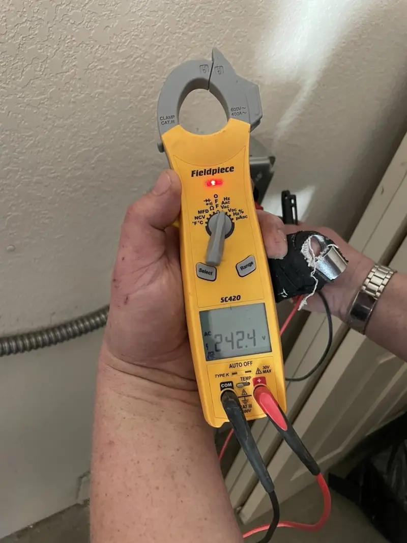 Voltage testing with clamp meter during Whole House Surge Protector in Shelton